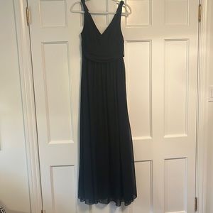 Floor length black sleeveless dress